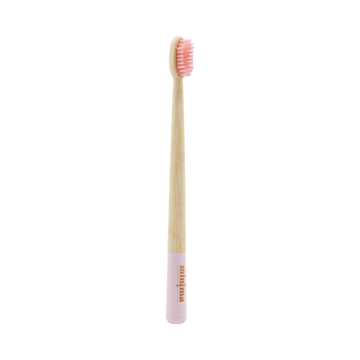 cepillo de dientes de bambú para adultos con cerdas rosa y franja rosa en el mango de mínima organics