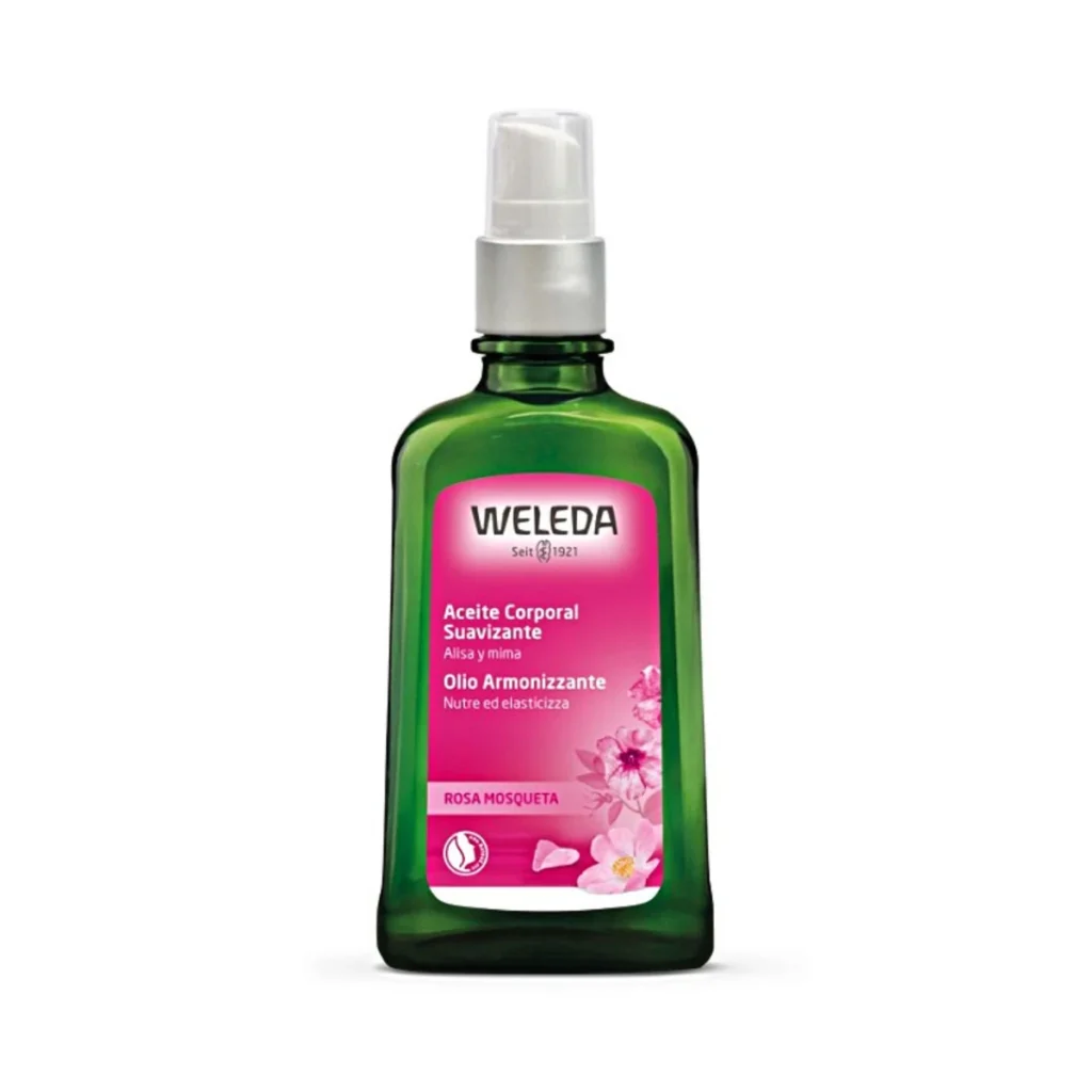 frasco de cristal verde con dosificador de aceite corporal armonizante de rosa mosqueta de weleda