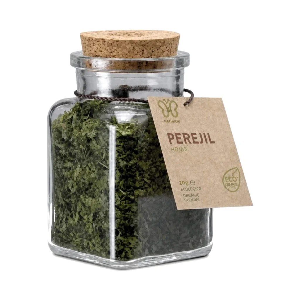 tarro de cristal con tapón de corcho de perejil en hojas ecológico naturcid